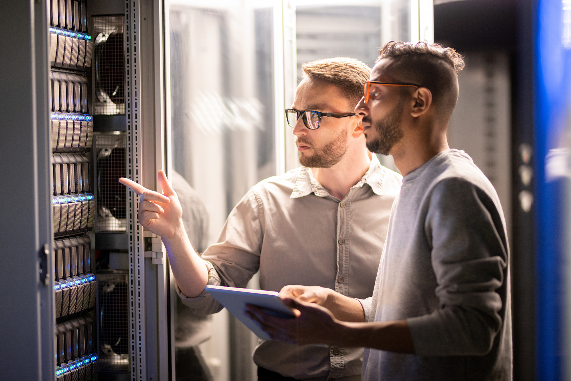 services Two engineers working in a data center